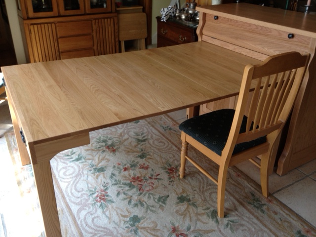 With leaves extended to act as a work table, desk, buffet or dining table. Amish Furniture Factory
