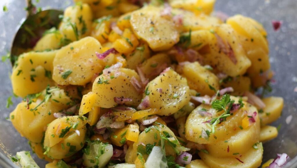 a bowl of Amish potato salad