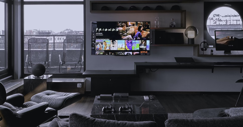 what color furniture goes with dark wood floors Very dark room with gray interior and TV on