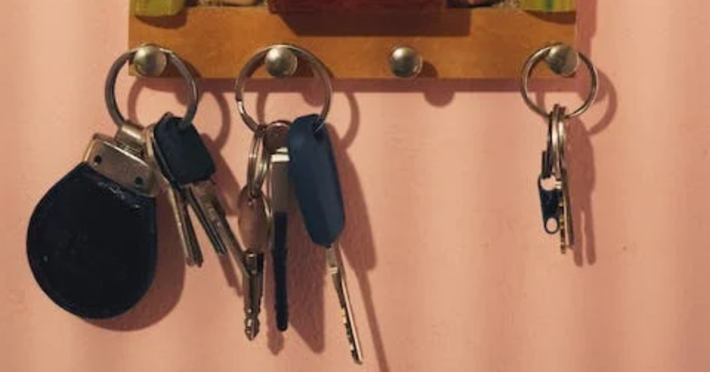 keys hanging on wooden wall-mounted keyholder