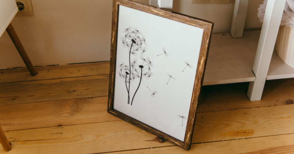 a wooden picture frame displayed on a wooden floor