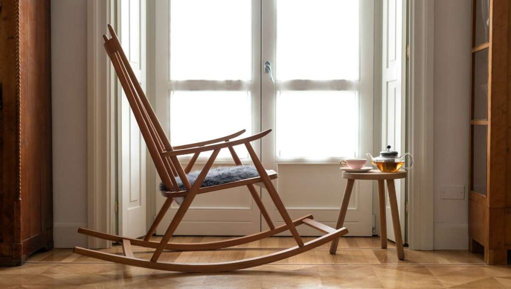 Wooden rocking chair near the window