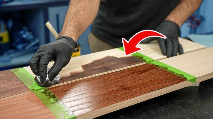 Man applying shoe polish to wood scratch