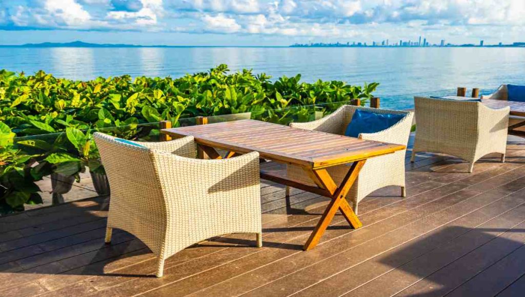 how to protect wood from sun damage Outdoor furniture including table and chairs exposed to the sun