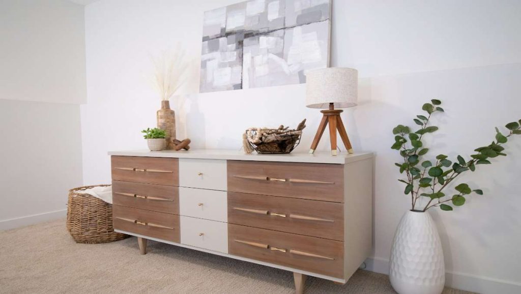 A white and brown dresser drawer in the bedroom