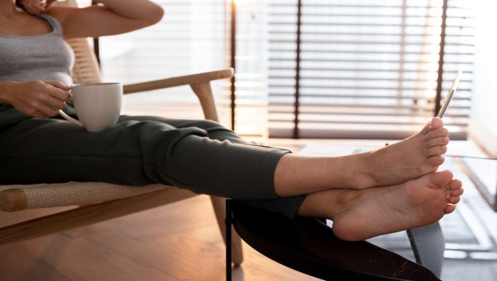 furniture you put your feet on Girl resting on a footrest furniture