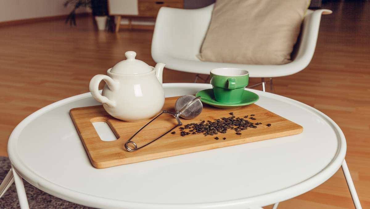 Coffee table with teapot and cup on top
