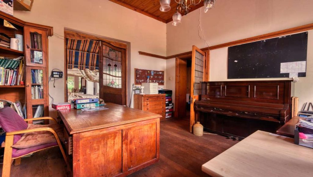 what color furniture goes with dark wood floors Cozy modern farmhouse with dark wood floor and vintage furnishings