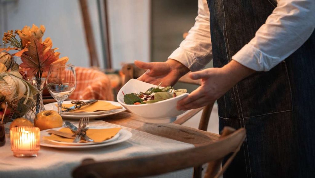 Woman serving food for Thanksgiving celebration